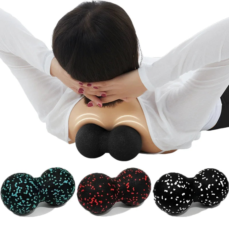 Person using a massage ball on a mannequin, with additional massage balls shown below.