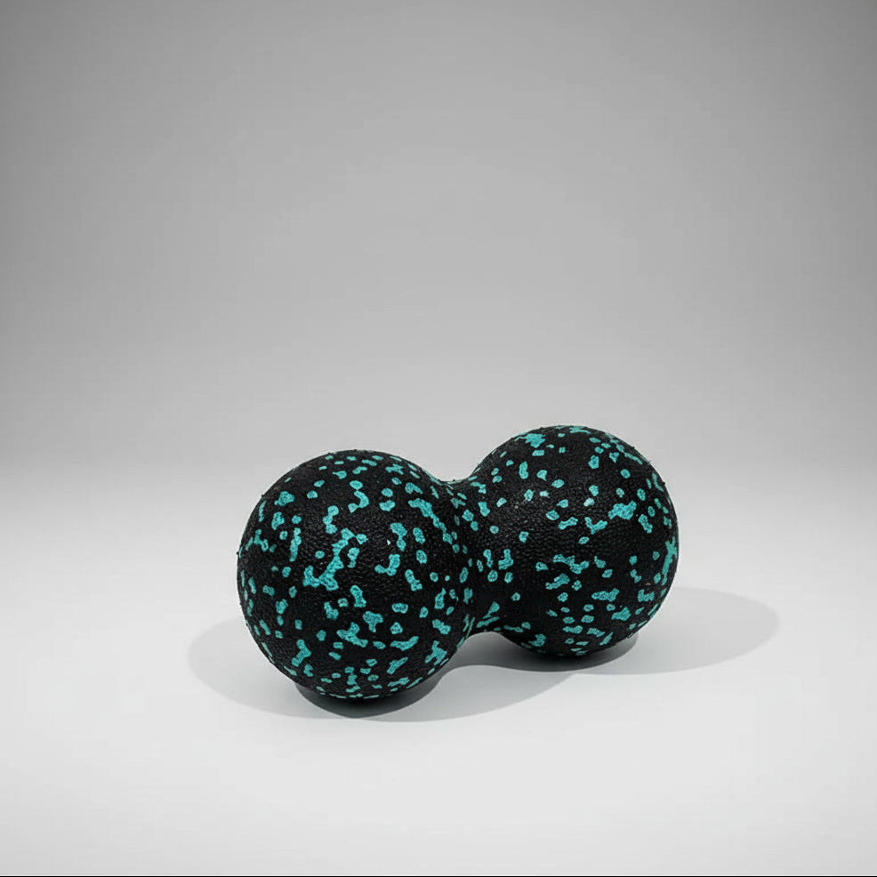 black and blue textured, peanut shaped ball with a neutral background.